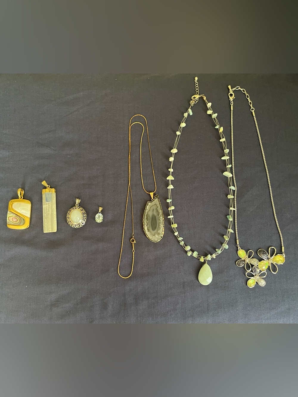 Collection of Three Beautiful Necklaces and Four Eye-catching Pendants